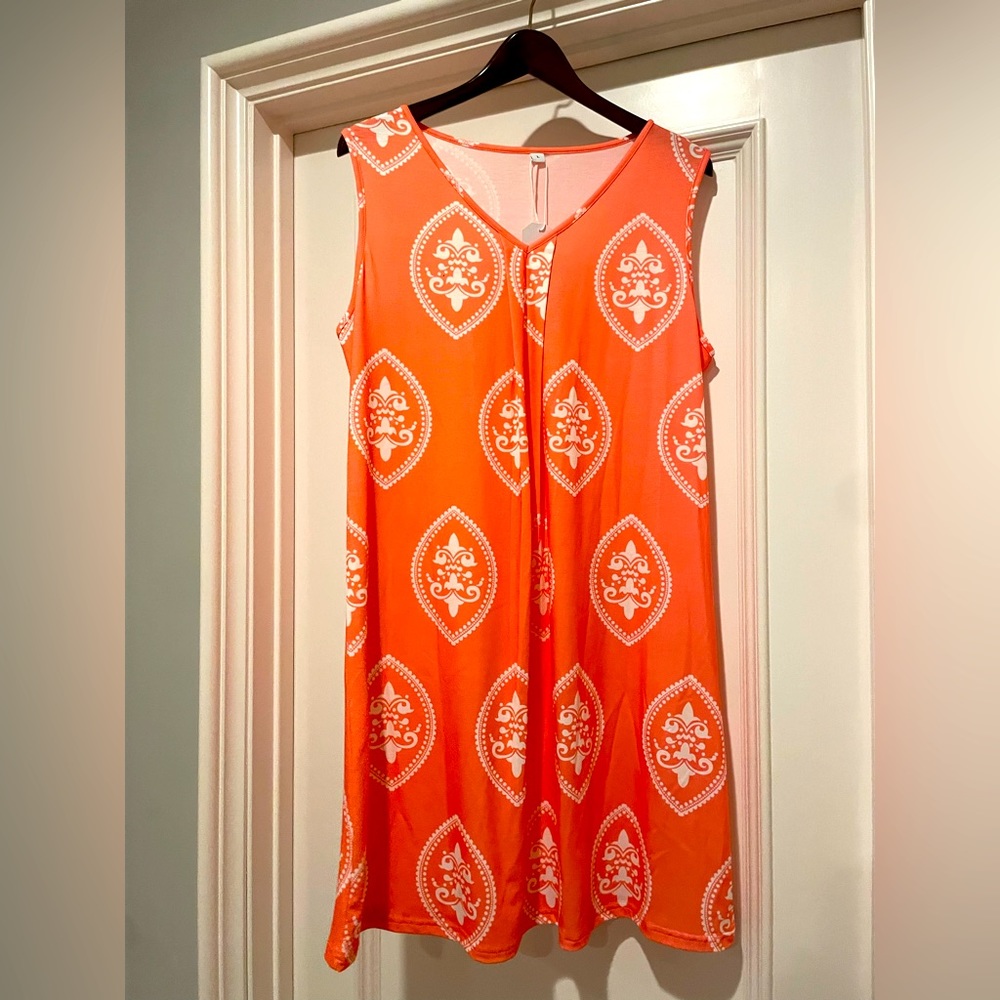 Orange and white dress. Brand new with tags. Size: Large.